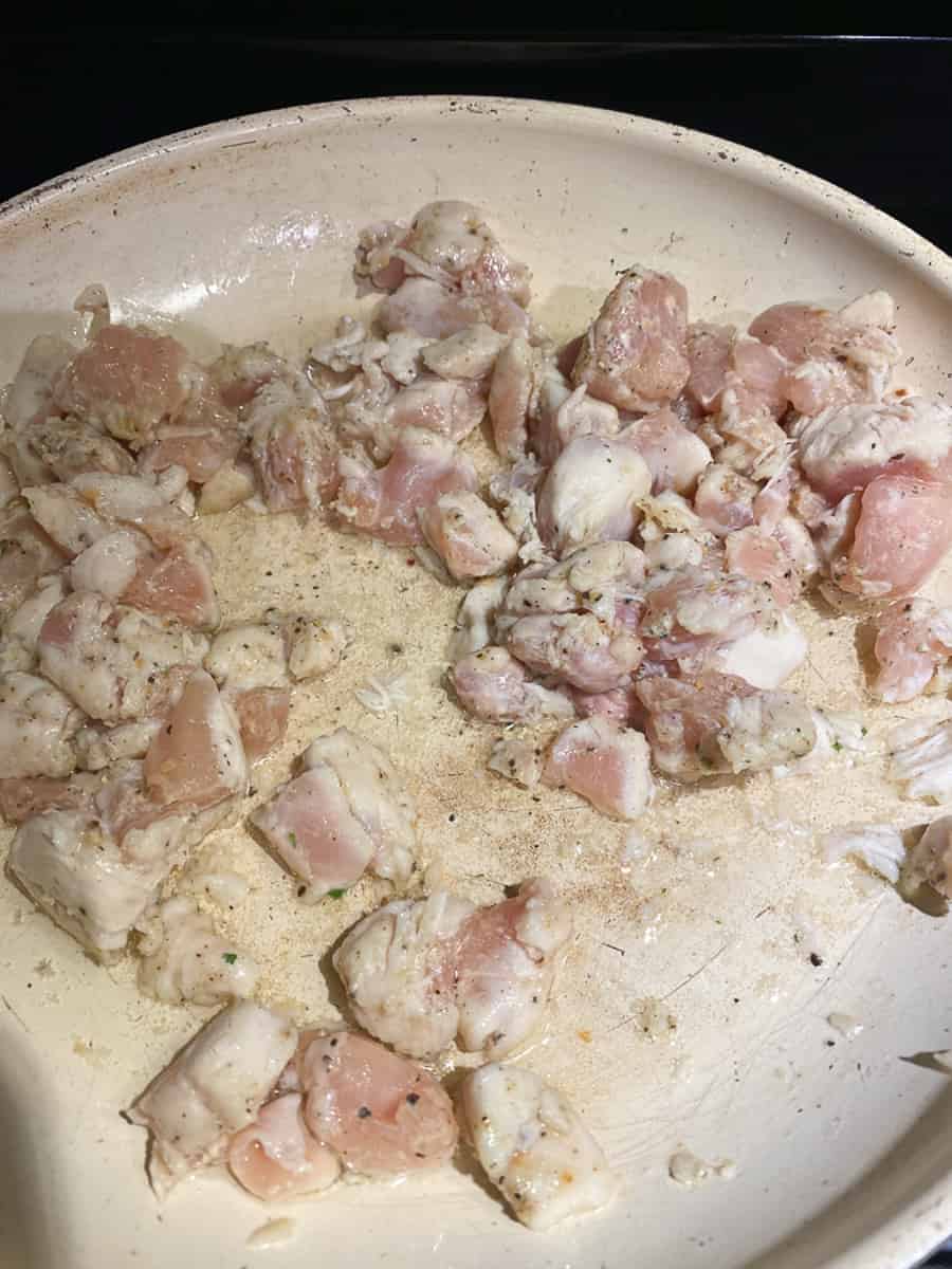 Saute chicken in olive oil in a frying pan
