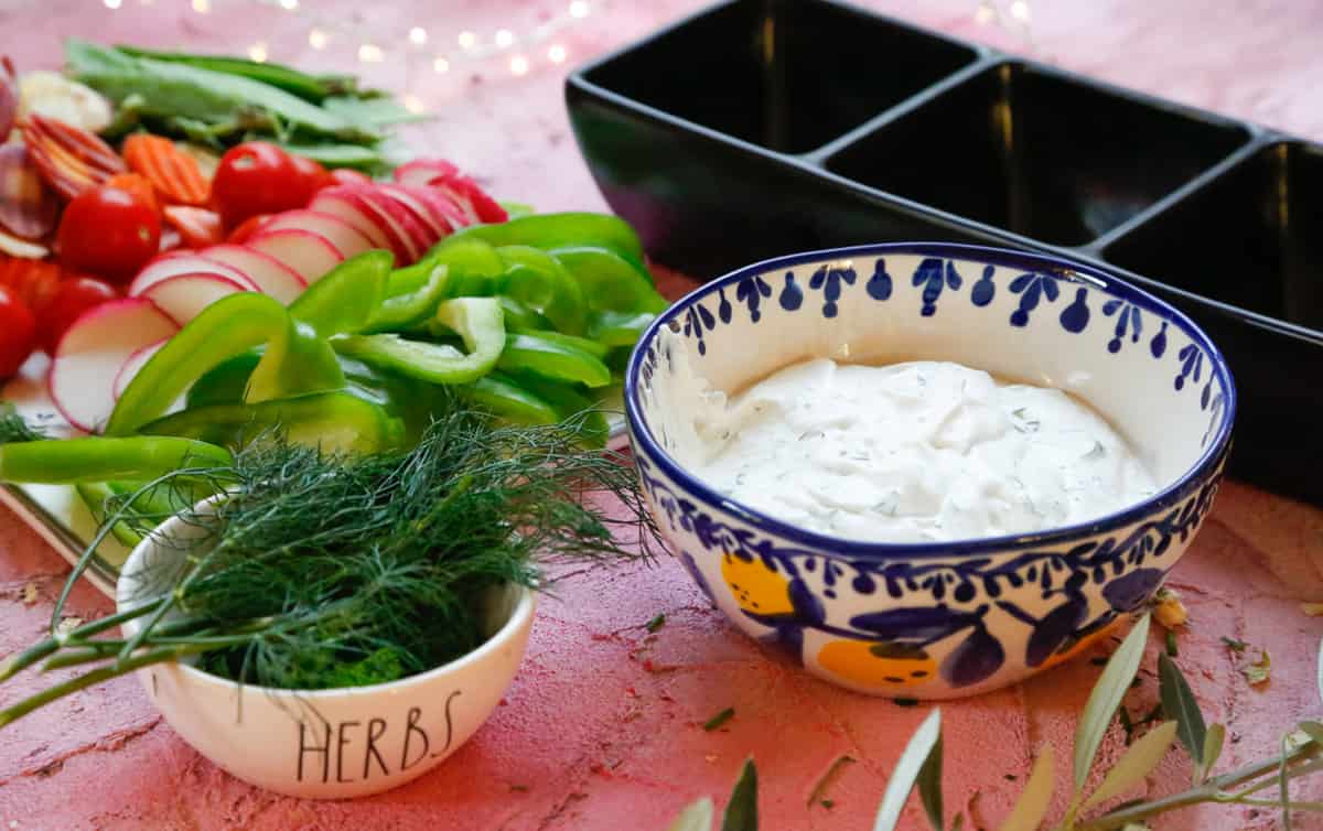 healthy ranch dip with veggies and fresh herbs 
