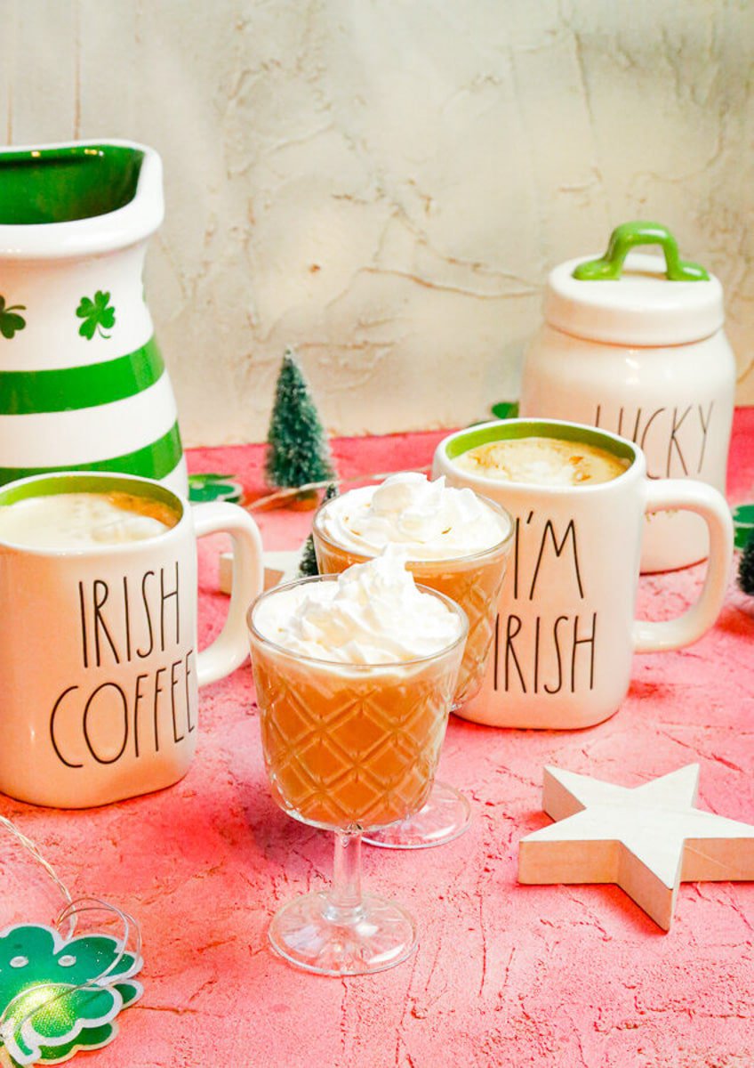 two Irish glass coffee mugs filled to the brim with Irish lattes that taste like honey and Saint Patrick's Day all rolled into one 