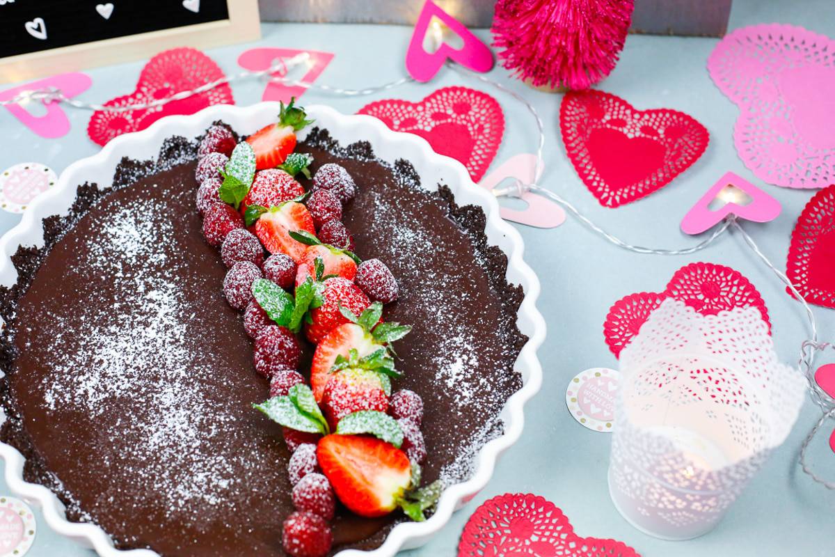 A tart plate of chocolate cake with berries 
