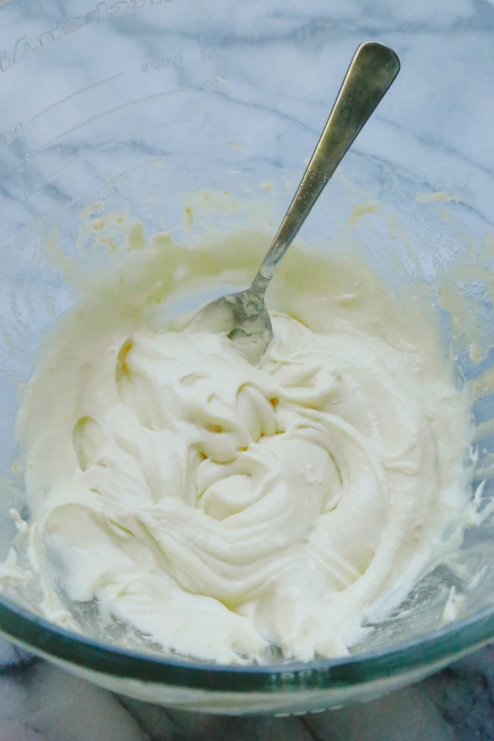 cream cheese and egg filling in a mixing bowl 