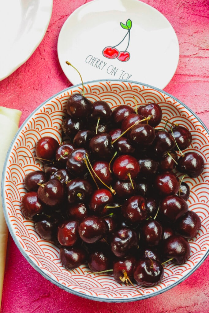 a bowl of bing cherries