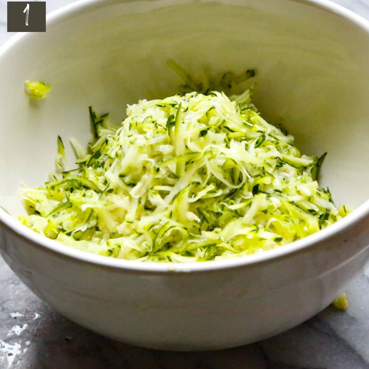 grate zucchini and squeeze out excess moisture using paper towl