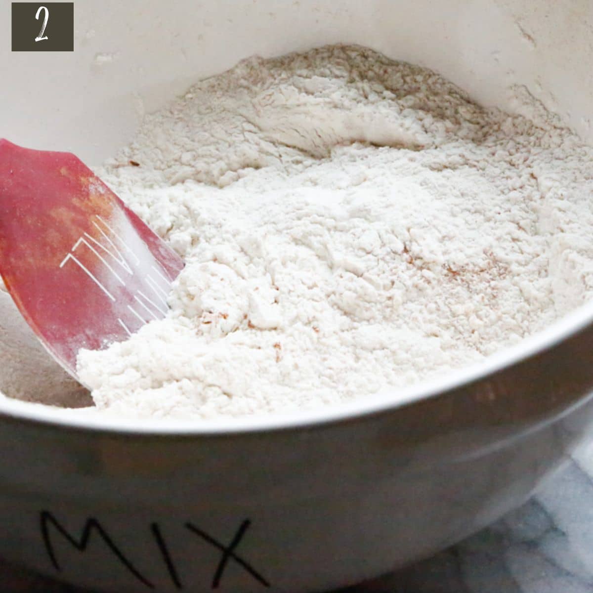 In a medium mixing bowl, add the flour, cinnamon, baking powder, baking soda, ginger, pumpkin spice, and turmeric and combine.
