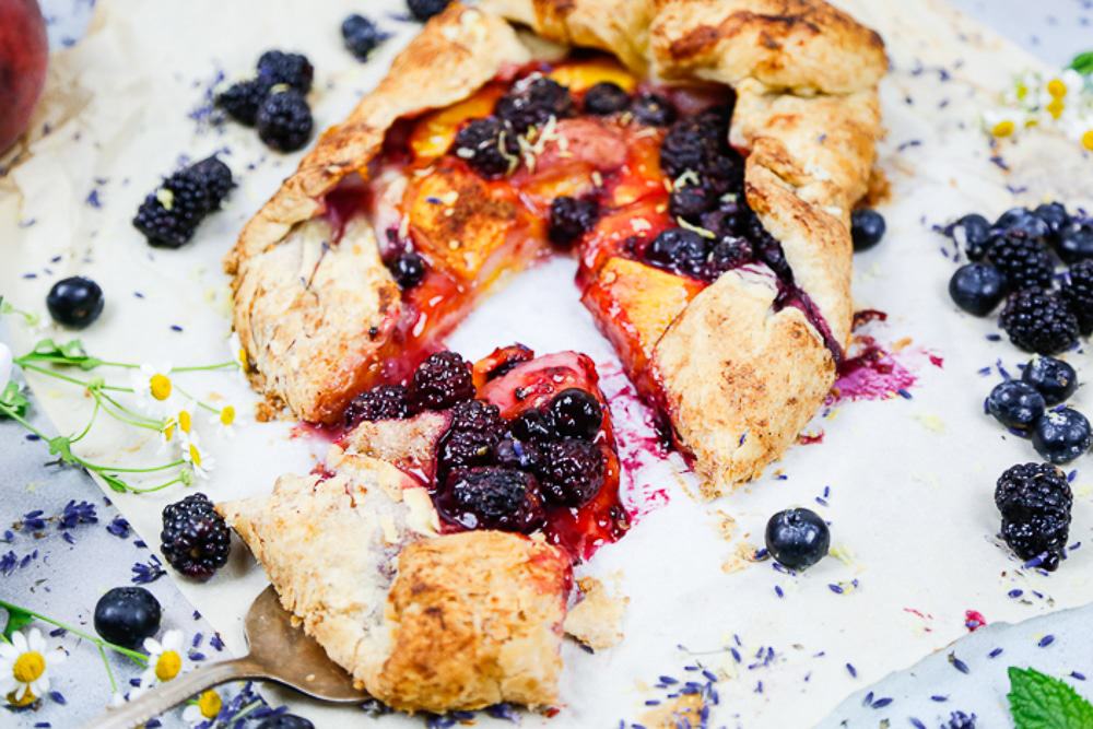 baked stone fruit galette with fresh blackberries and blueberries 