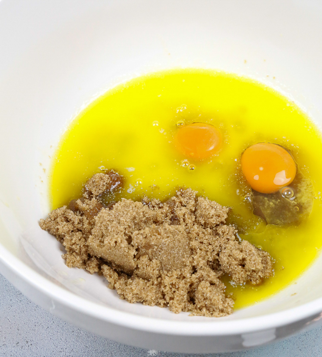 In a mixing bowl, combine the coconut sugar, melted butter, and vanilla extract and eggs in a bowl 