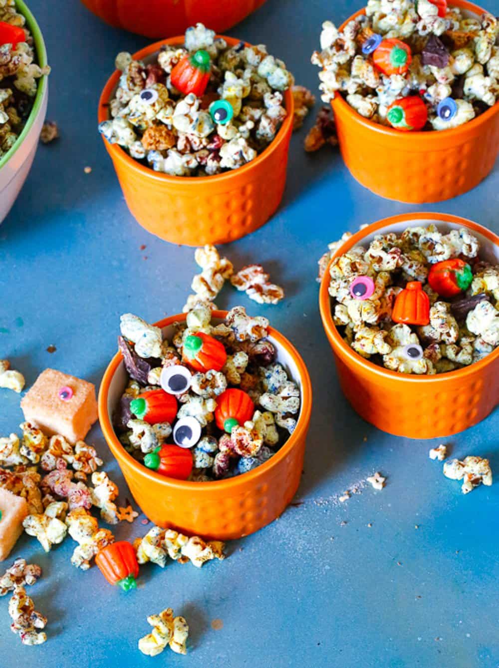 small bowls filled with halloween eyes, popcorn, and candy, monster mash popcorn