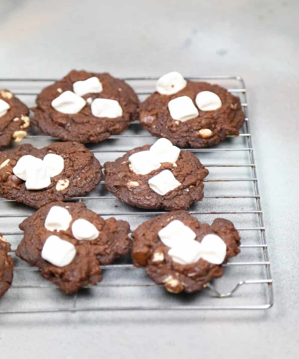 A tray of chocolate marshmallow cookies on a metal baking sheet 