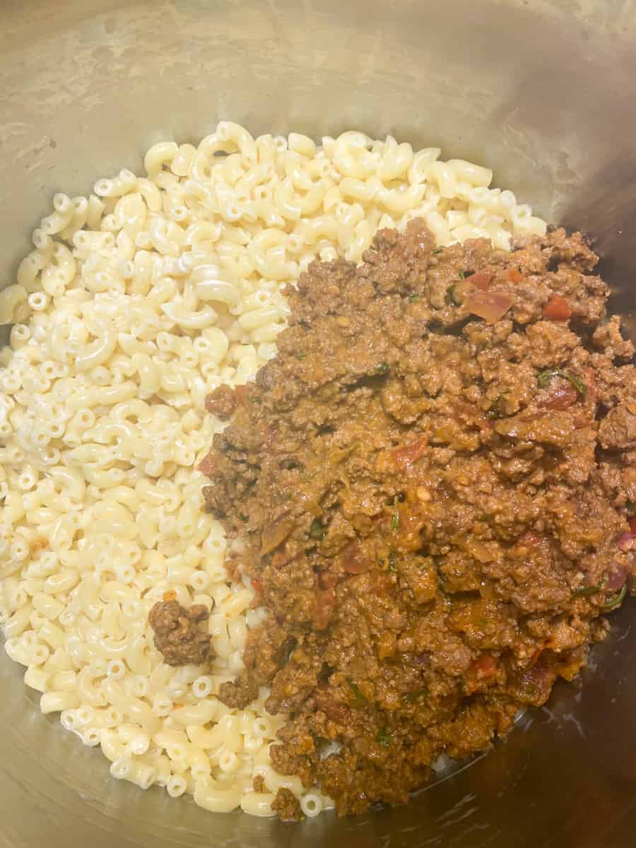 Add the cooked macaroni to the ground beef mixture. 