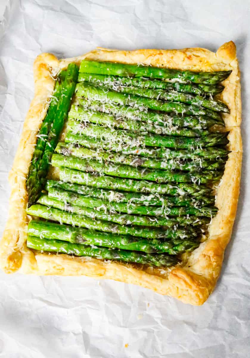 asparagus puff pastry baked on parchment paper