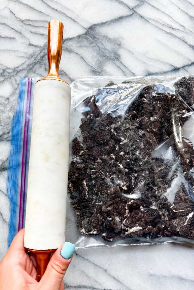 a marble rolling pin and a bag of crushed oreo cookies 