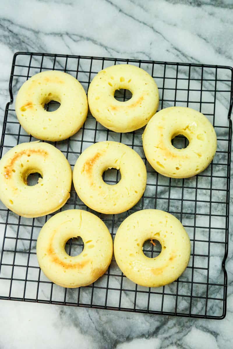 baked donuts on a cooling rack 