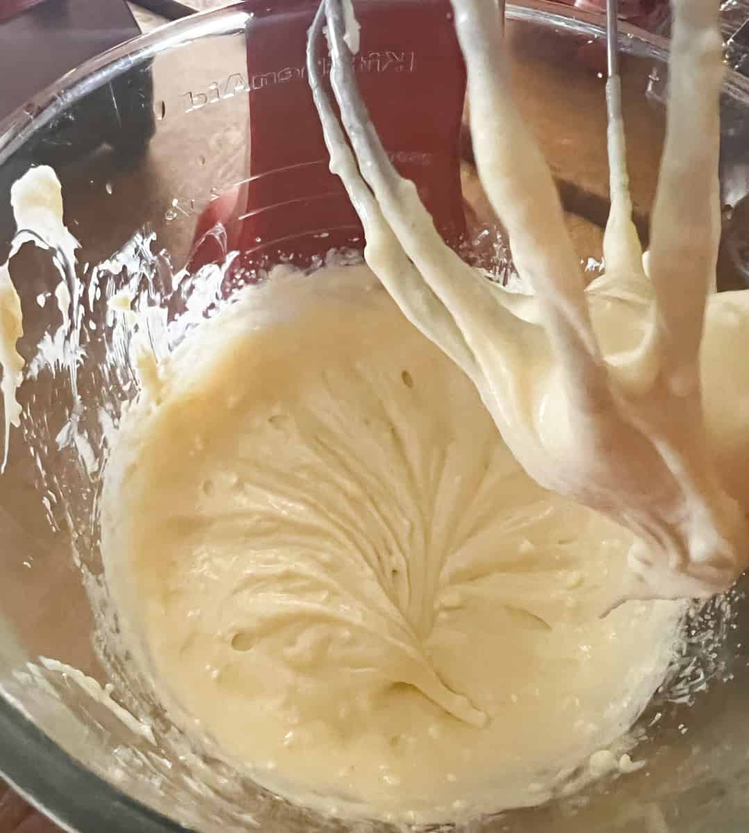 in a stand mixer mix cream cheese batter for strawberry turnovers 