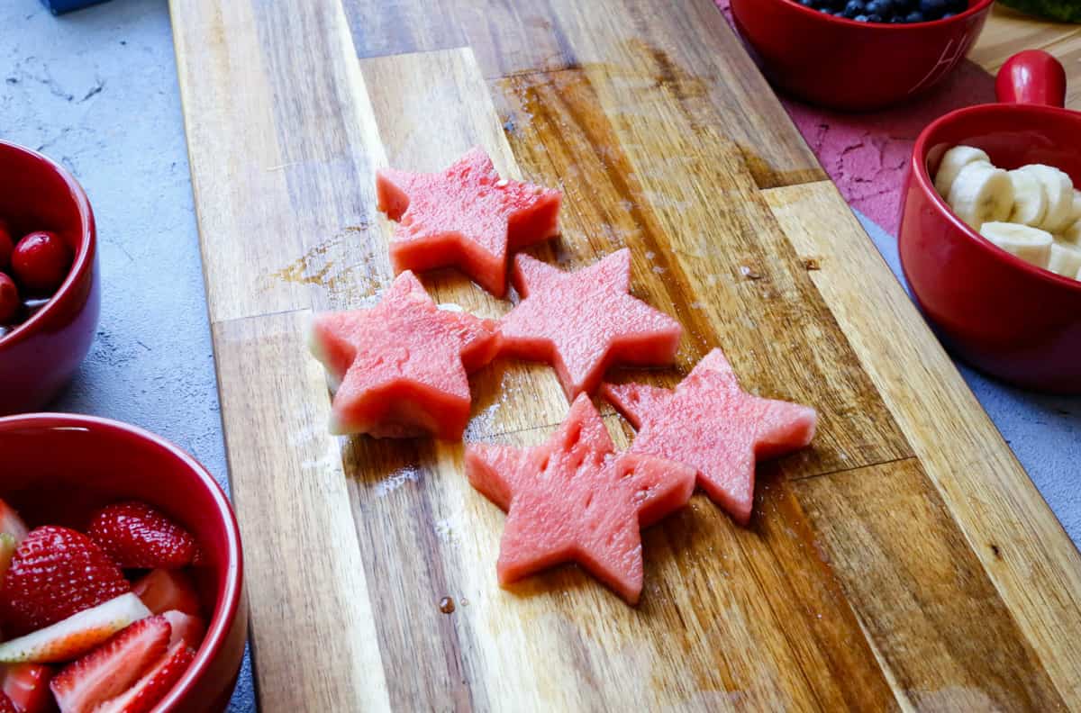 watermelon stars on a wooden cutting board 