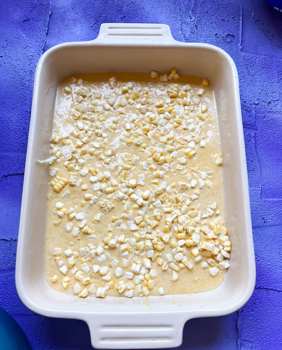 add a layer a fresh corn to the cornbread mixture 