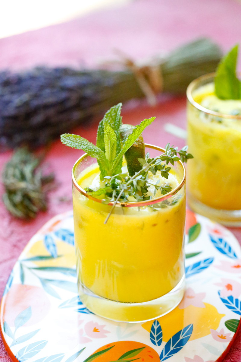 juice with fresh mint and thyme sprigs 