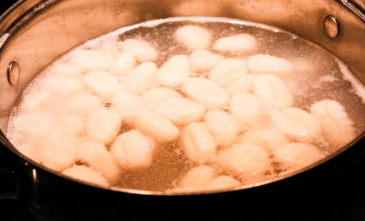 potato gnocchi boiling in water on the oven 