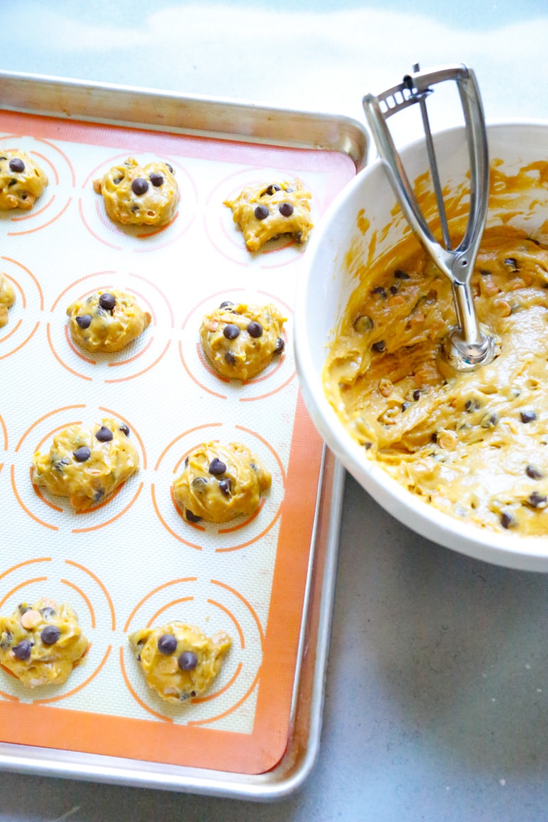 Using a cookie dough scooper, scoop the cookie batter into 1-inch balls onto a lined baking sheet. You can use wax paper or a silicone liner. 