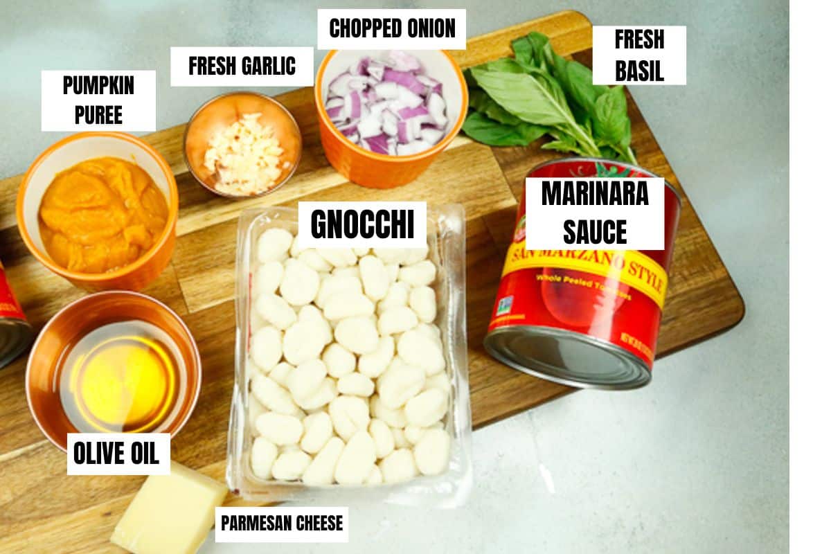 ingredients for gnocchi marinara parmesan cheese, basil, garlic, chopped onion, marinara sauce, olive oil and pumpkin puree