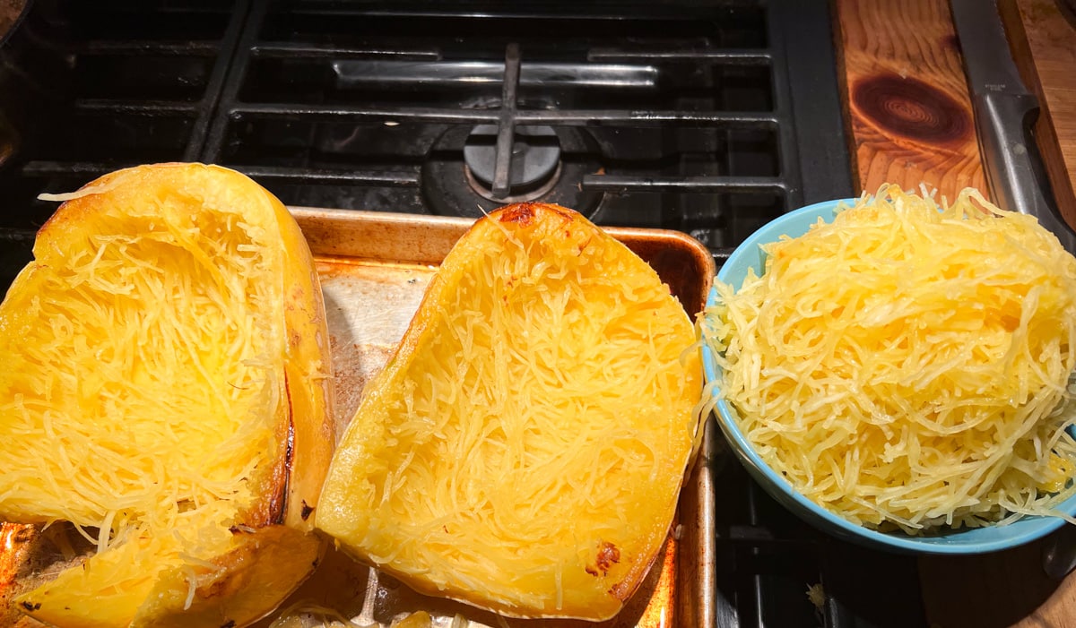 When cool enough to handle, scoop out squash, separating strands with a fork; set shells and squash aside.