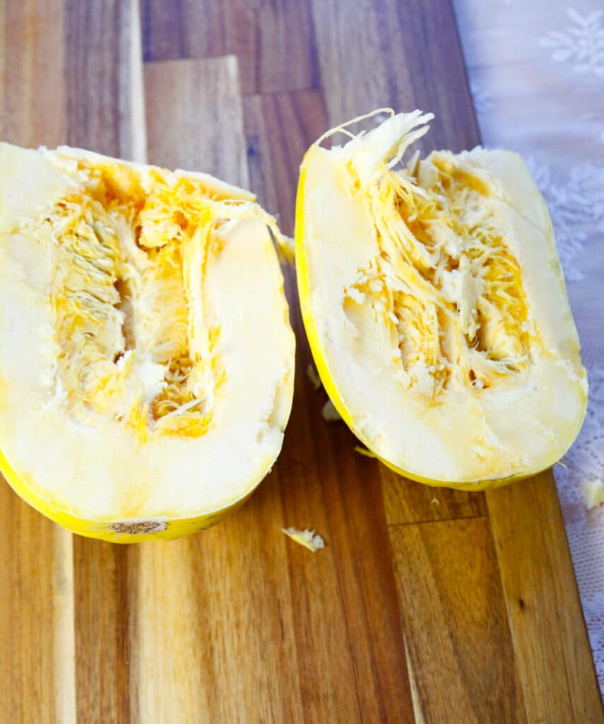 cut squash in half lengthwise and scoop out the seeds 