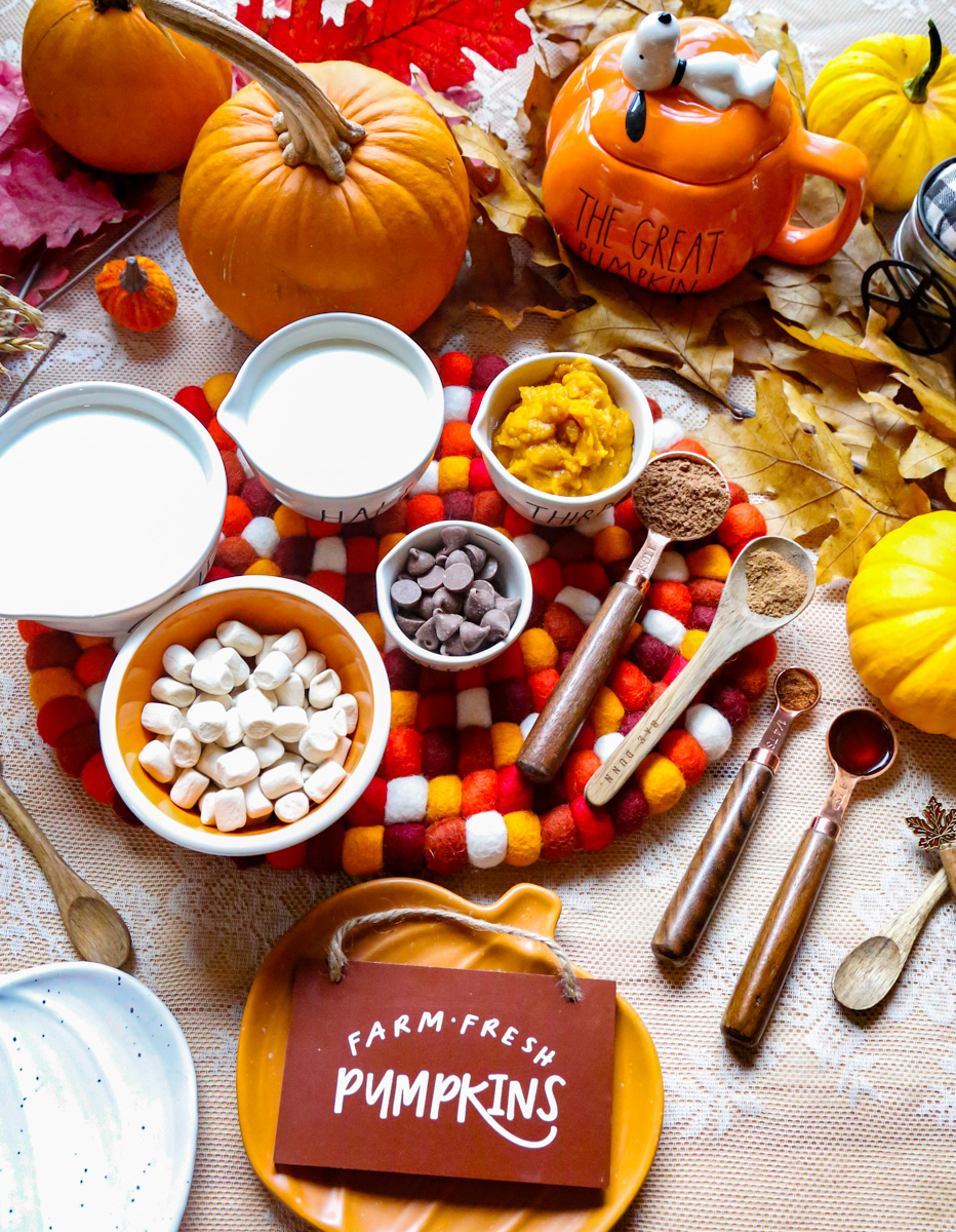 Ingredients for pumpkin spice hot chocolate include chocolate chips. pumpkin puree, mini marshmallows, heavy cream, pumpkin spice 