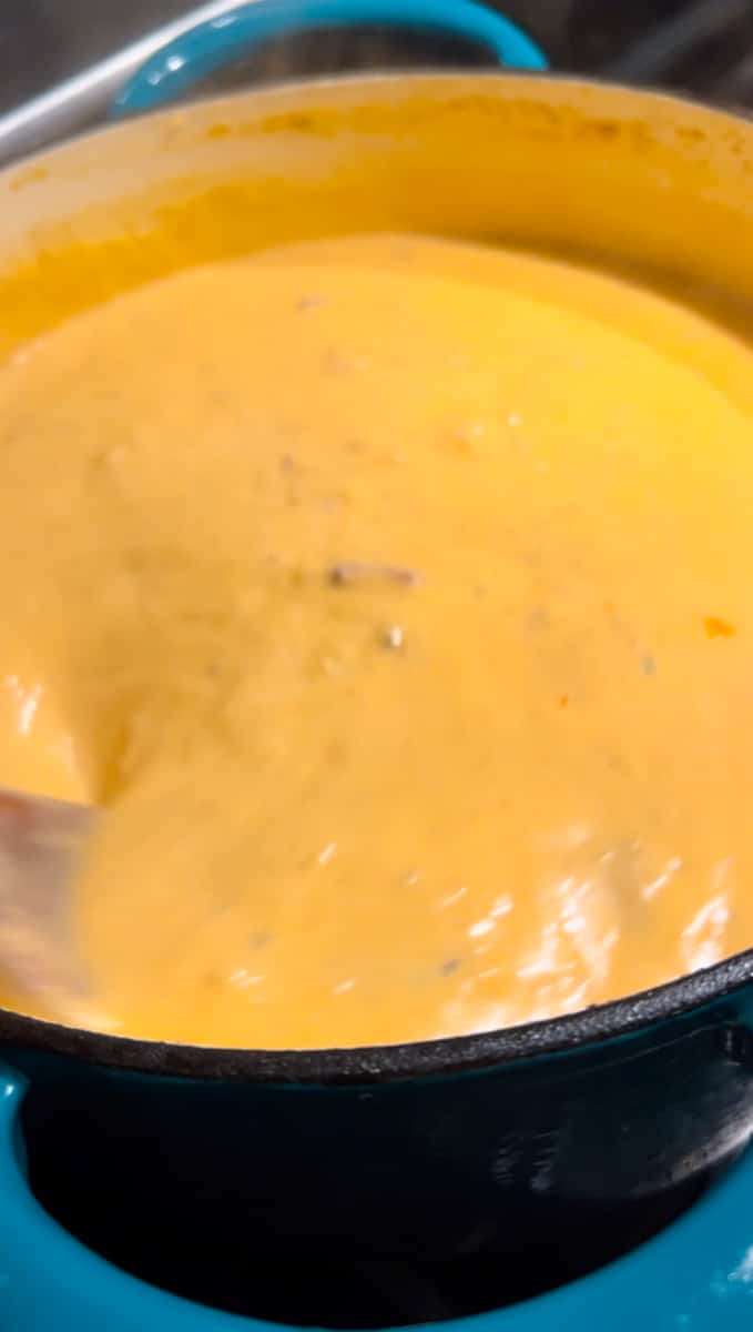 Use an immersion blender to blend the potato soup 