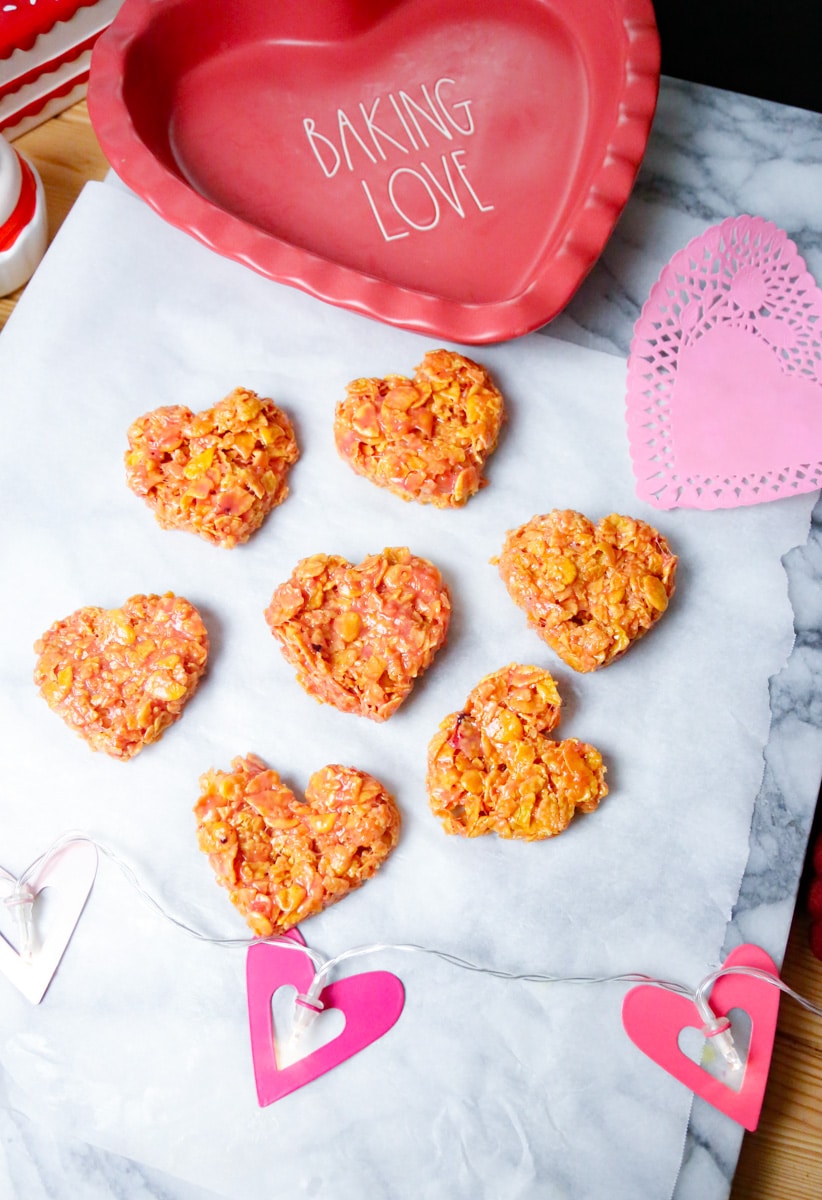 Add the Valentine's Day sprinkles and press the m&m's into the cookies. Let the chewy cornflake cookies cool or refrigerate for 15 minutes before serving. Serve and enjoy!