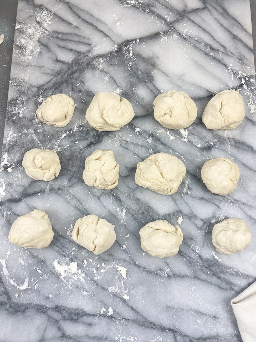 buttery buns dough on a floured marble surface let rise for thirty minutes under a towel for easy buttery buns 