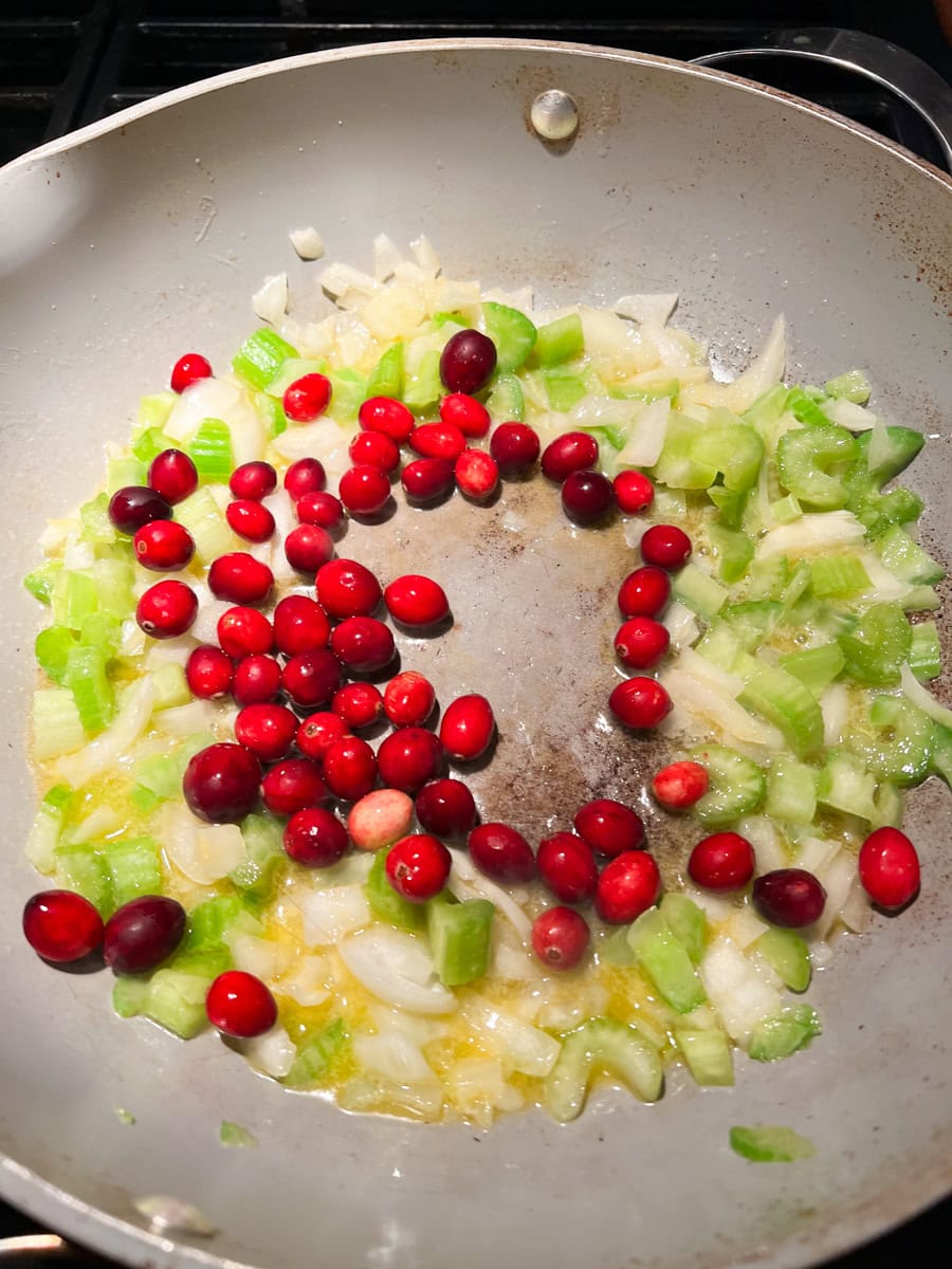 cranberries, chopped celery, and butter saute in a frying pan over medium heat for cornbread stuffing