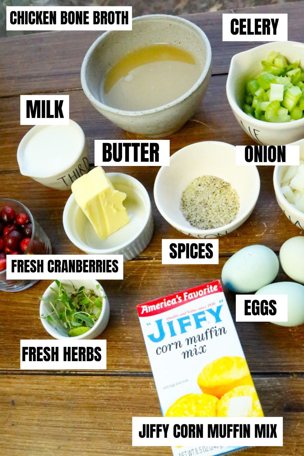 Ingredients for stove top stuffing with cornbread include Jiffy corn muffin mix, milk, onion, celery, cranberries, spices and butter 