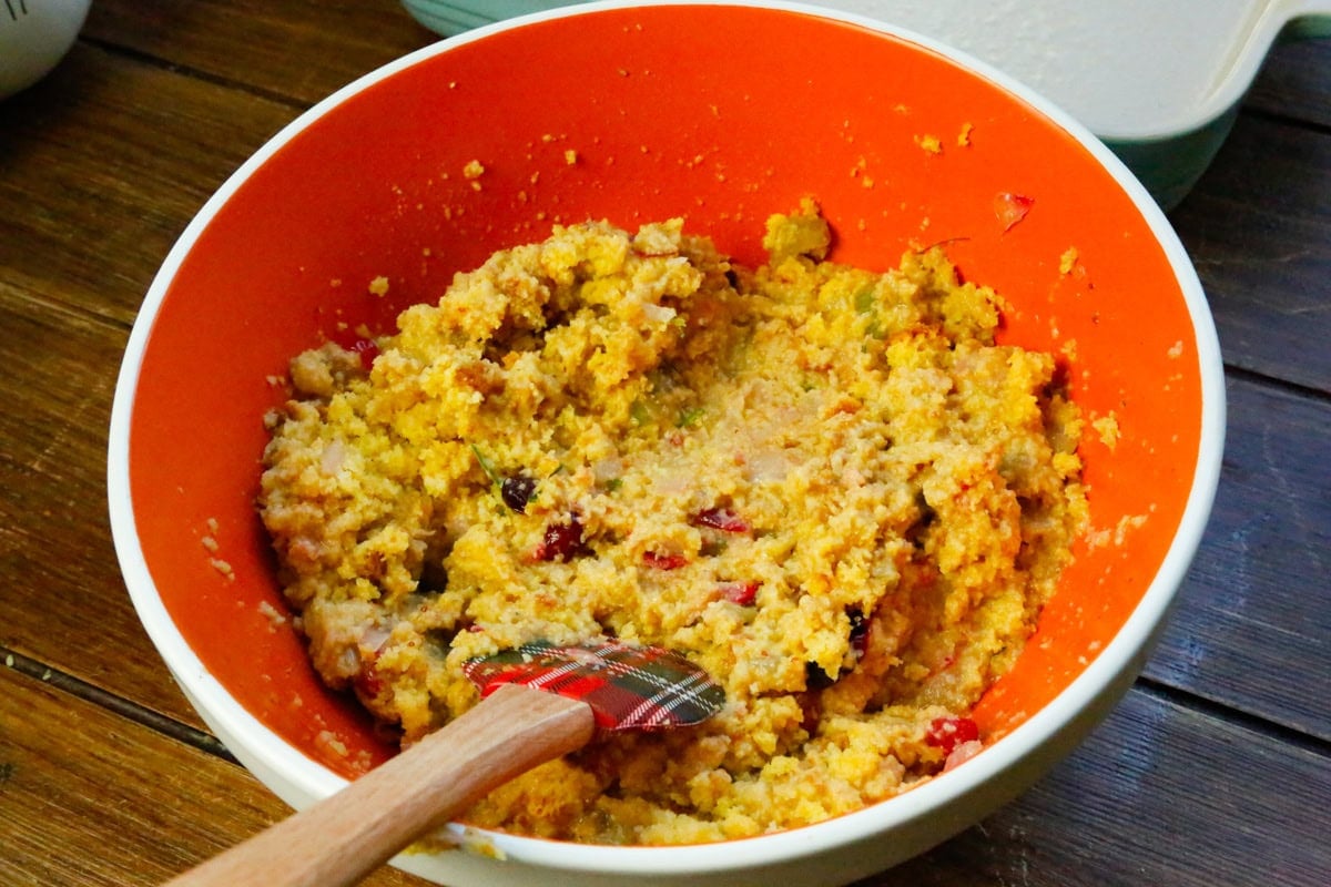 Next, add the prepapred cornbread into the stuffing mixture and mix well until combined.