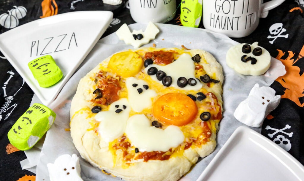 spooky pizza with homemade pizza dough and ghost, witch, and bats