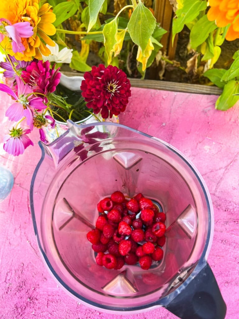 In a blender, add the fresh raspberries and maple syrup and blend on high until combined. Use a fruit strainer to strain out the fresh Raspberry Syrup into a cup or leave the raspberry seeds, you don't really notice them in the cold foam at all. Set the homemade raspberry syrup aside.