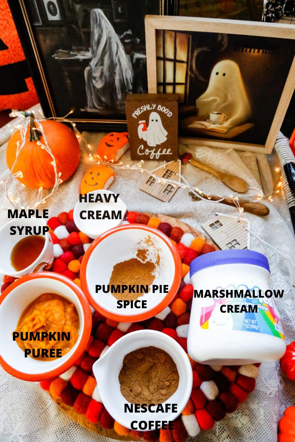 Ingredients for pumpkin spiced iced coffee include pumpkin spice, heavy cream, marshmallow cream, pumpkin puree, Nescafe instant coffee, water