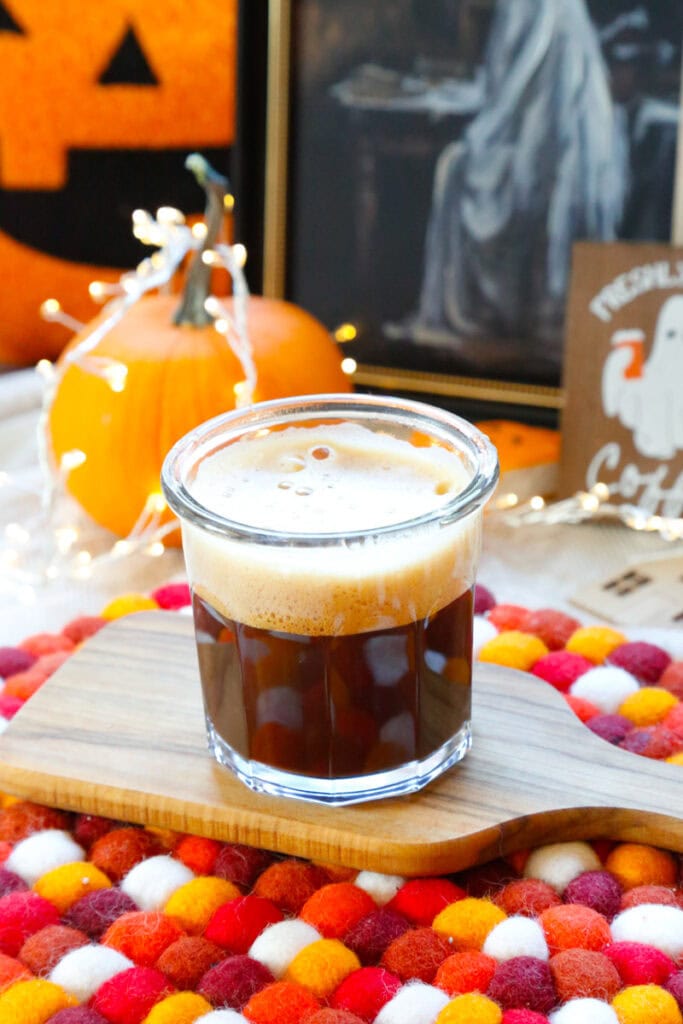 In a separate glass, prepare the coffee. Take 1 tablespoon of Instant coffee and mix with 2 ounces of hot water or use prepared iced coffee for this. Add the prepared coffee to the pumpkin spice syrup and mix well until combined. 