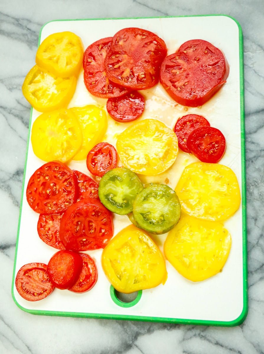 Tomatoes: You’ll need four large (sliced) tomatoes. You can peel the tomatoes if you want, but I didn't find it necessary for this dish. I use fresh Heirloom tomatoes from my garden and my favorites for this dish are Lemon Boy Tomatoes, Abraham Lincoln Tomatoes, Beefsteak Tomatoes, and Amana Tomatoes, and the Porkchop Heirloom tomatoes. Basically, the beefier and meatier the tomatoes, the better. Think thick tomatoes here. :)