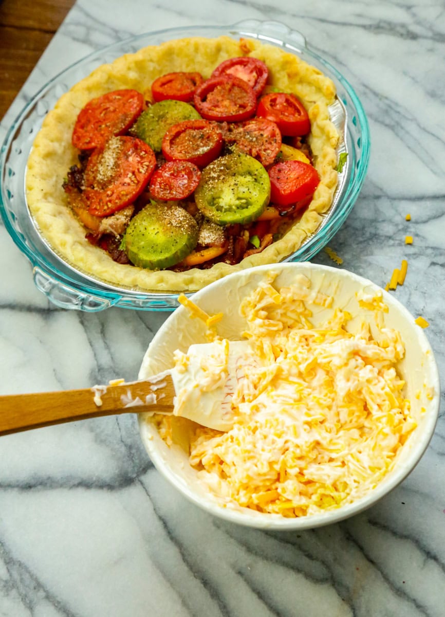 Stir together cheese and mayonnaise in a small bowl. Spread the shredded cheese mayo combo over the top of pie and over loosely with aluminum foil.