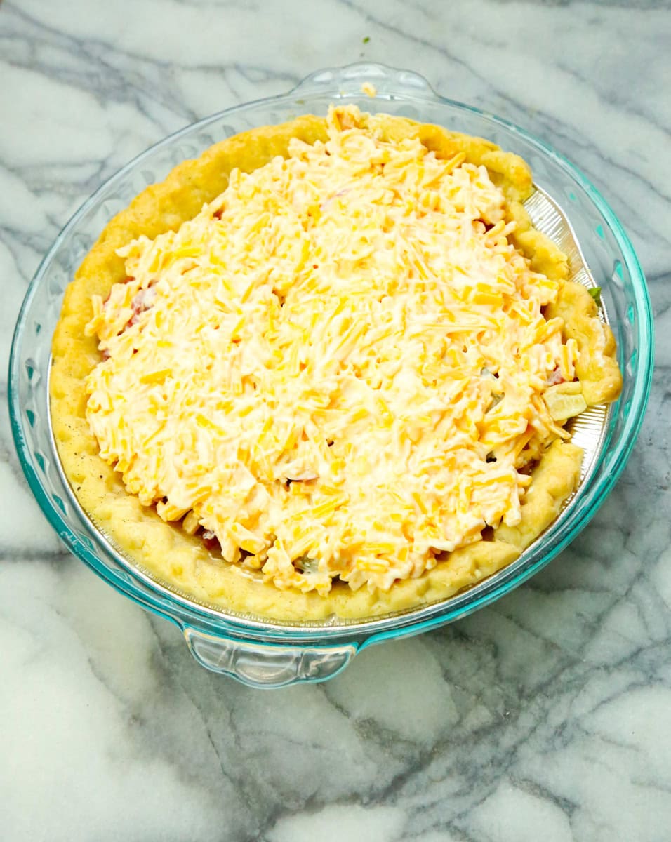 Bake in the preheated oven for 30 minutes. Remove foil and continue baking for 30 more minutes. Serve warm with sour cream and more fresh basil for garnish. Enjoy!