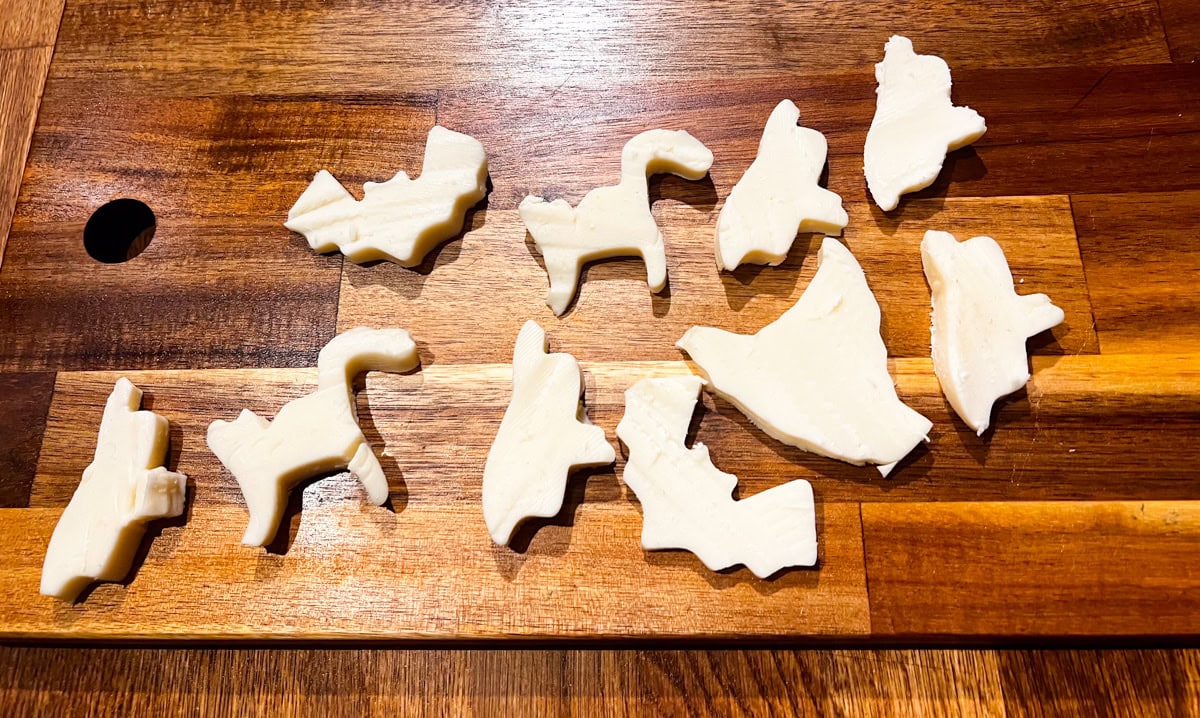 Slice the mozzarella cheese into thick slices and use the Halloween cookie cutters to make your Halloween shapes. 