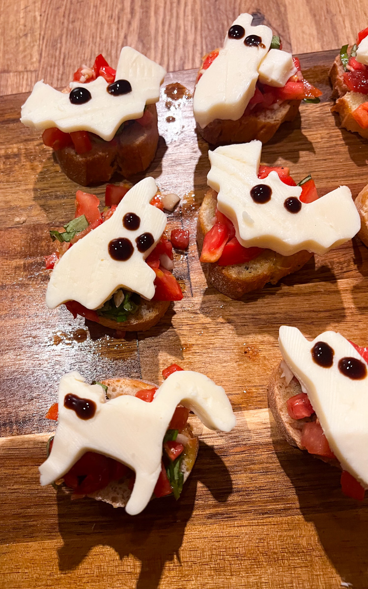 Top with your Mozzarella ghosts and make the eyes using the Balsamic Glaze, gently dot circles for the eyeballs and ghost face. Eat immediately and enjoy! 
