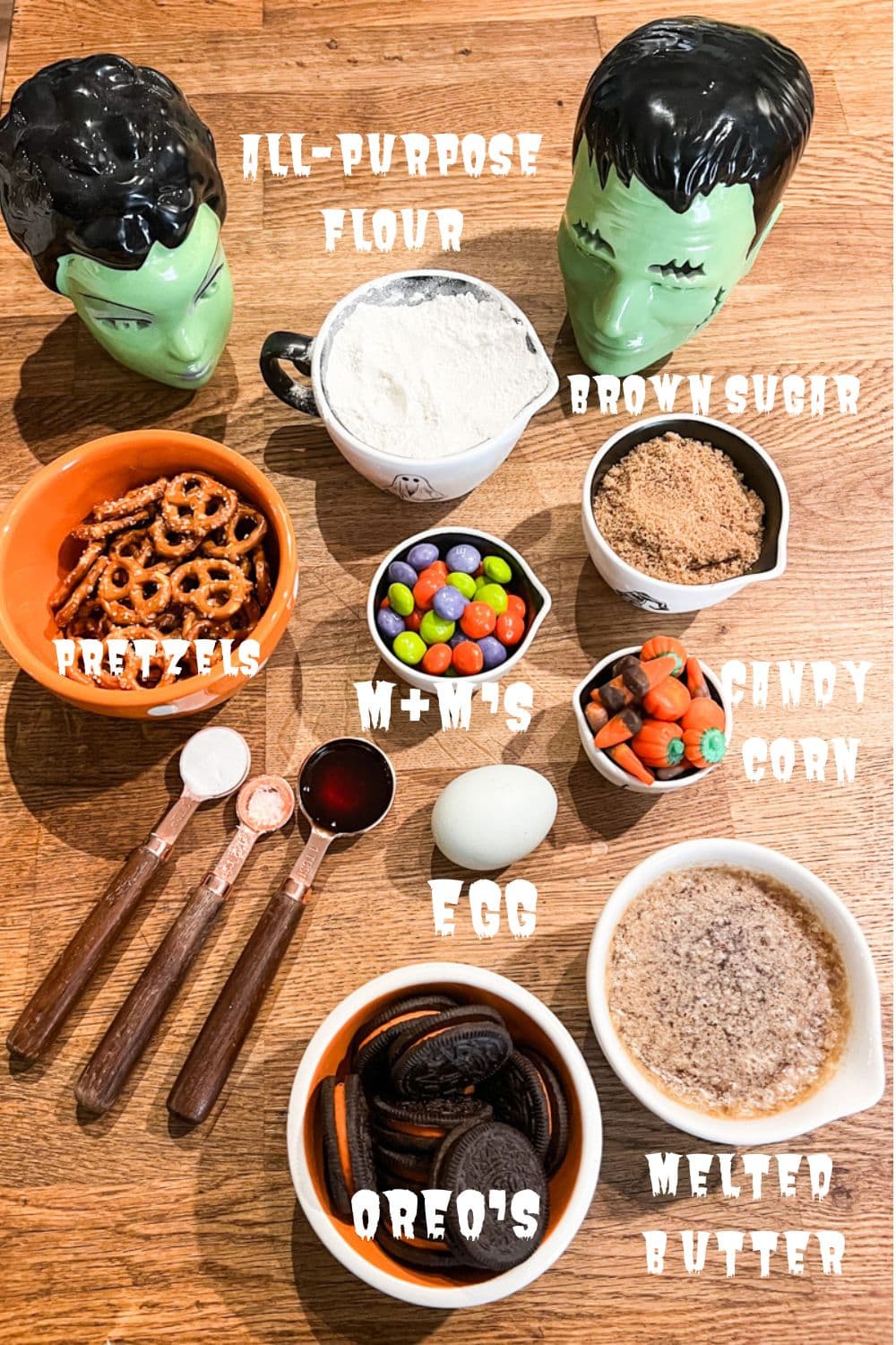 Ingredients for Halloween Cookie Bars include pretzels, all-purpose flour, Halloween M&M's, brown sugar, melted butter, egg, Halloween Oreos, sea salt, baking powder, vanilla extract 