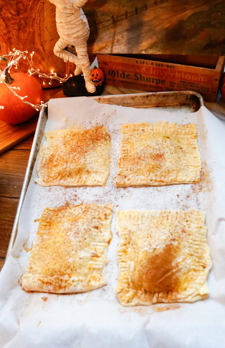 Sprinkle the prepared Pumpkin Pop Tarts with more pumpkin spice and bake in the oven at 350-dgrees for 40-minutes or until golden brown.