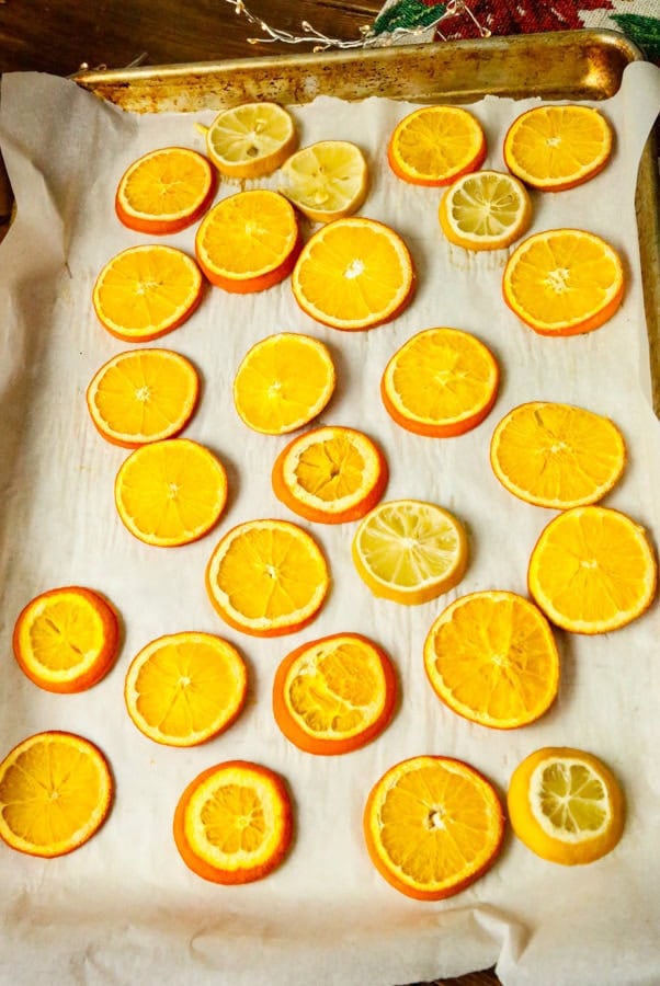 Set you oven to 200-degrees **don't go above this setting, take it from me. I did and I burnt my oranges to a crisp!** Bake 2–4 hours, flipping halfway, until dry and no longer sticky.
(They should look leathery, not brown.)