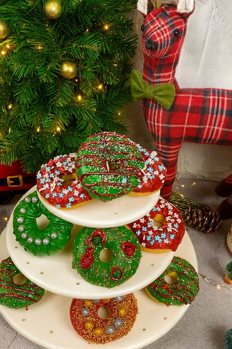 Donuts for Christmas with garland and a reindeer in the background