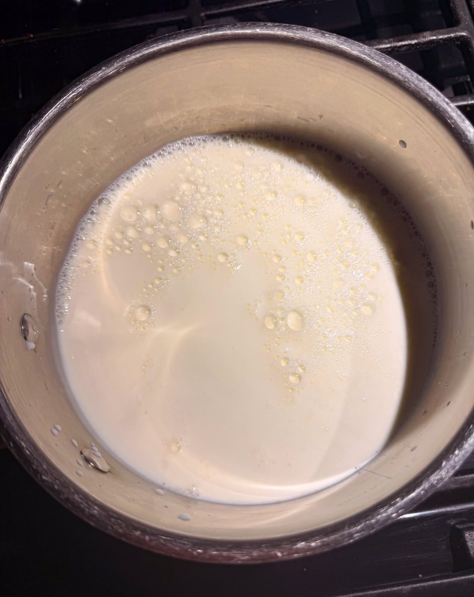 Pour the whole milk and heavy cream into a
small saucepan and heat over medium-low
heat. Warm it gently until steaming, not
boiling.