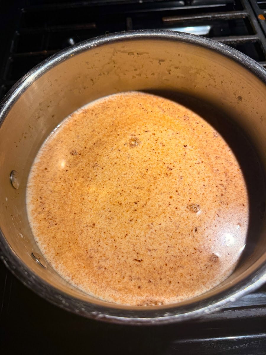 Add in the Vanilla Extra then whisk in the semi-sweet chocolate chips. Stir constantly until the chocolate fully melts and the mixture turns smooth and glossy.