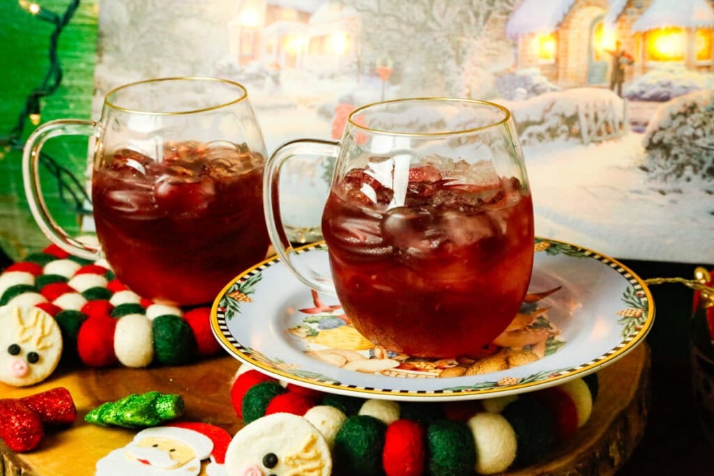 Add ¼ cup cranberry juice to each glass and swirl until combined.