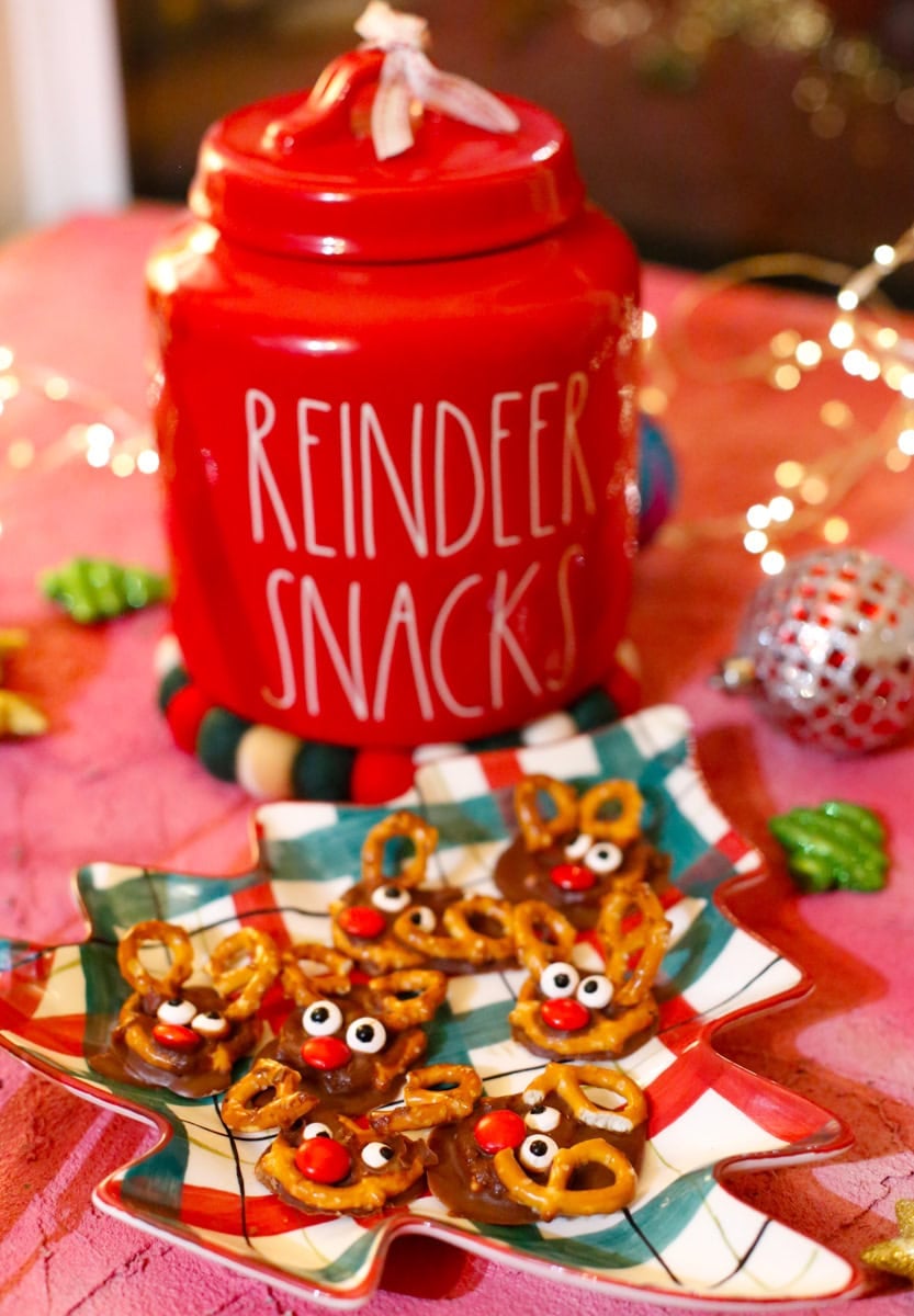 Pretzel Reindeers with a reindeer snacks canister on a Christmas tree plate