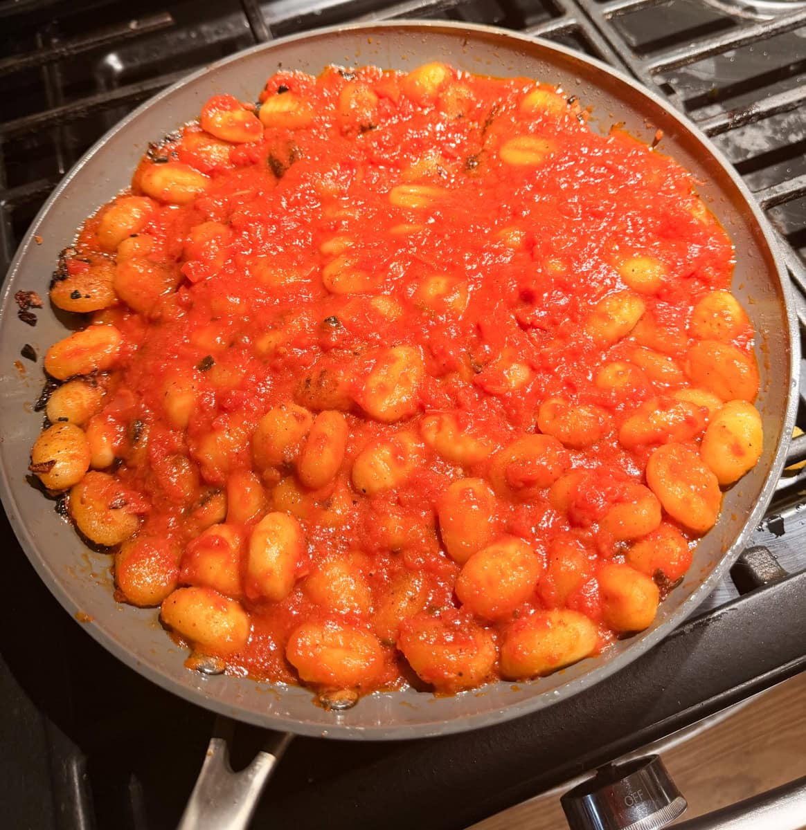 Stir in the marinara sauce and pizza seasoning coating the gnocchi and stir until combined.